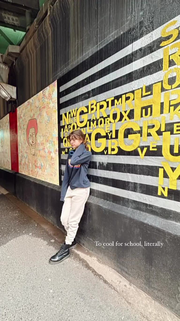 Posing at a Tokyo street mural