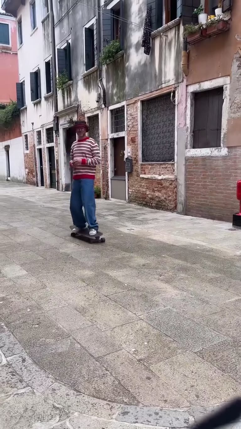 Skateboarding through a Venice alley