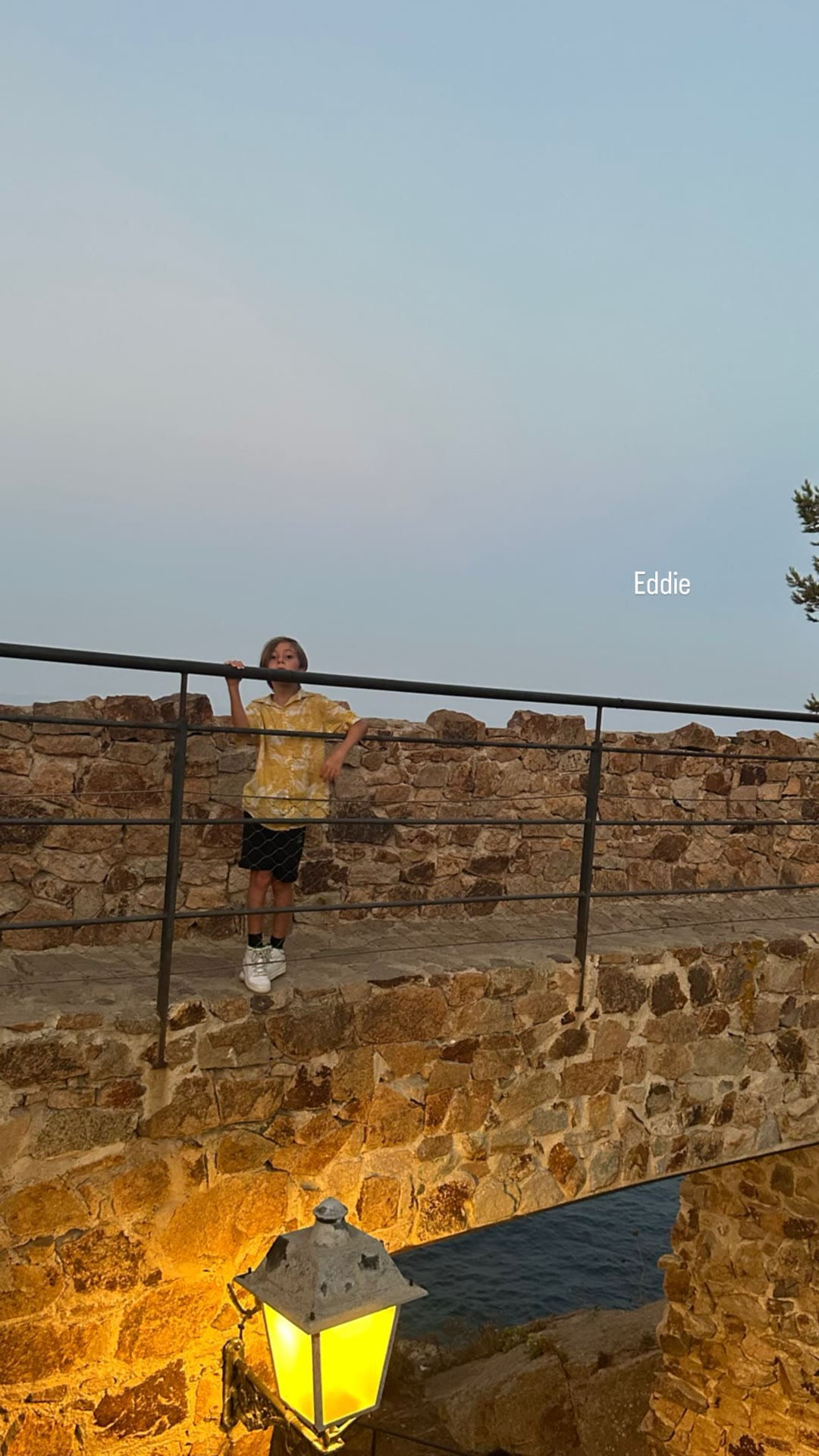 Eddie on the sea wall at golden hour, Spain