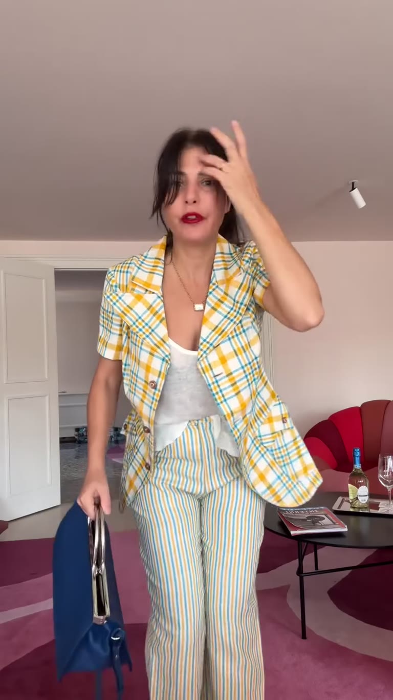 Outfit check in a pink hotel suite