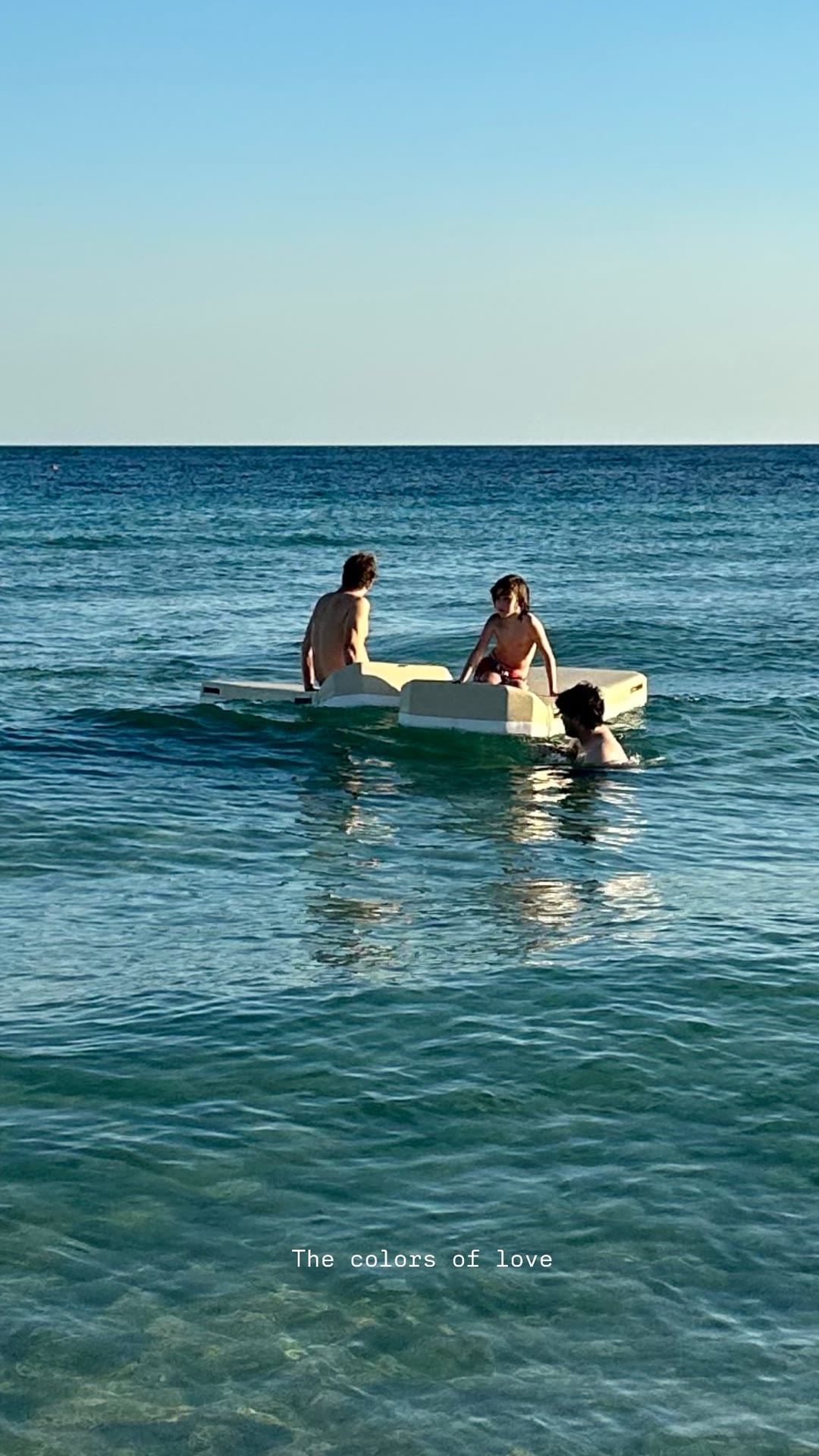 Kids on a pedal boat in Puglia's clear sea