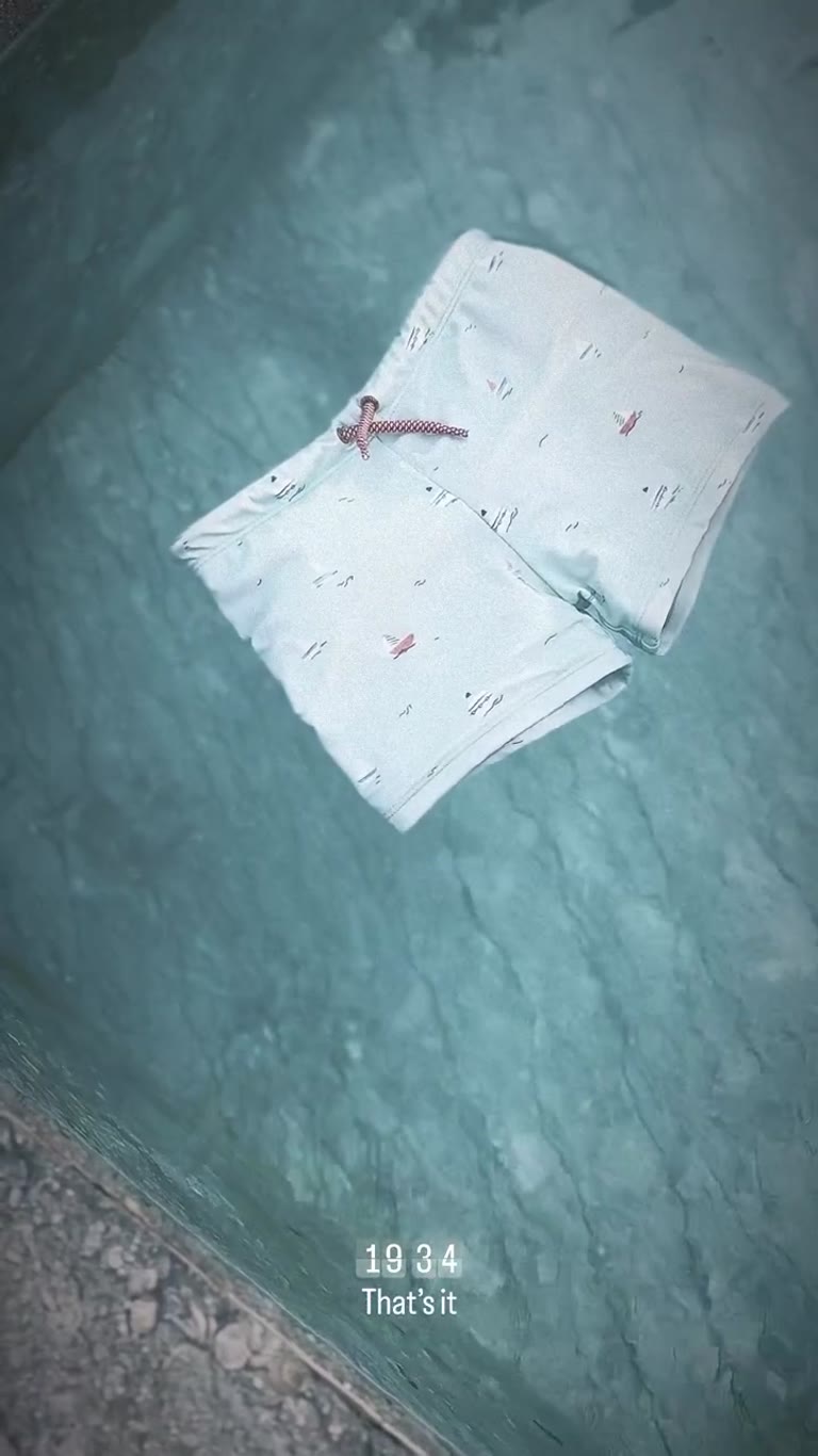 Swim trunks floating in the pool
