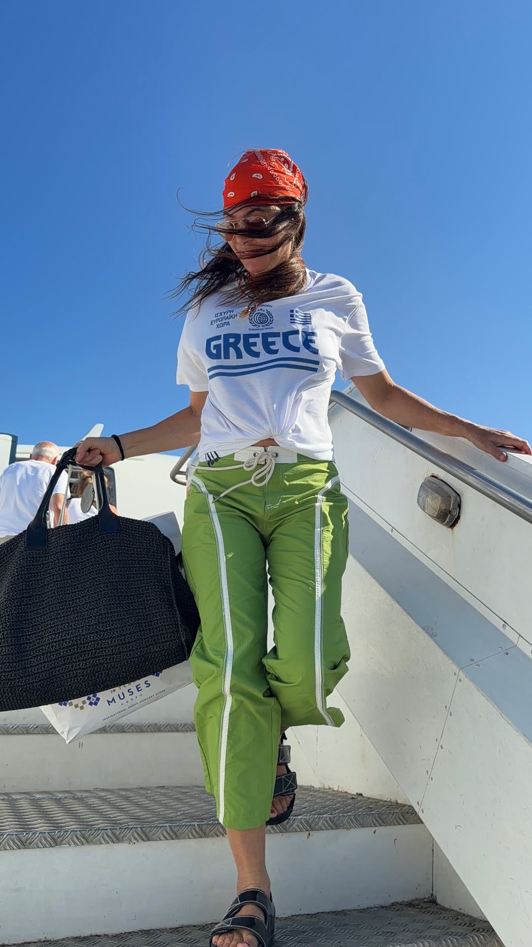 Landing in Corfu with a Muses shopping bag