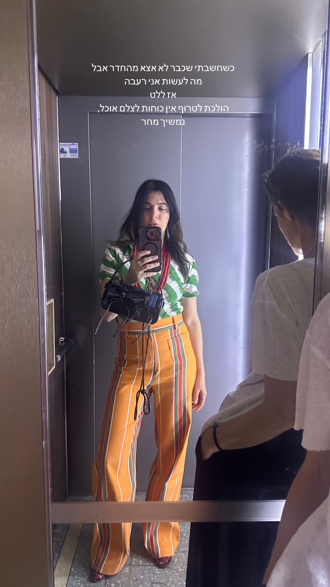 Elevator mirror selfie before a Paris dinner run