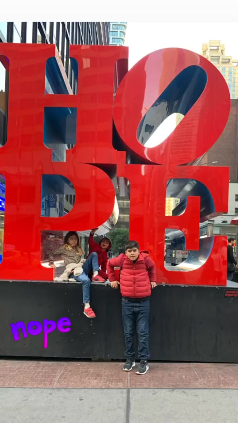 HOPE sculpture photo stop with kids in NYC