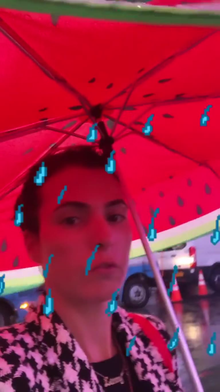 Rainy day selfie under a watermelon umbrella