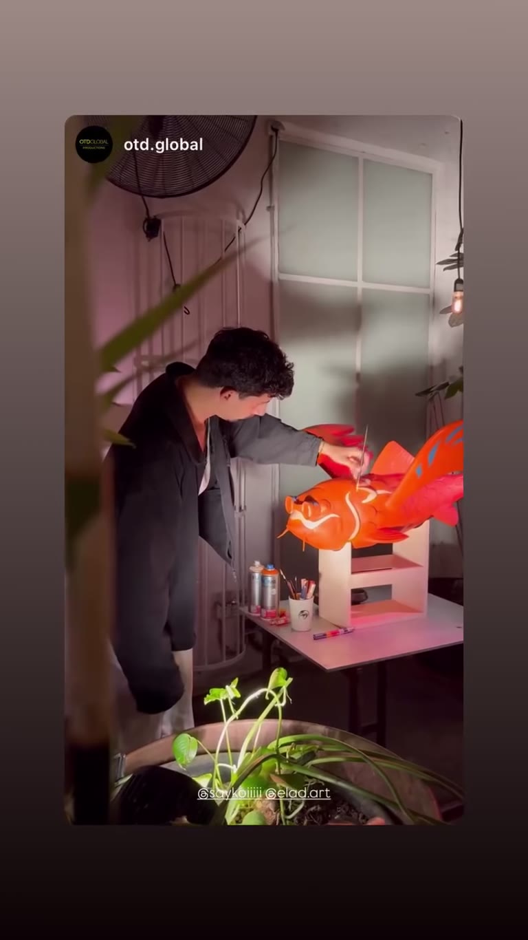 Behind the scenes: painting a giant koi fish sculpture