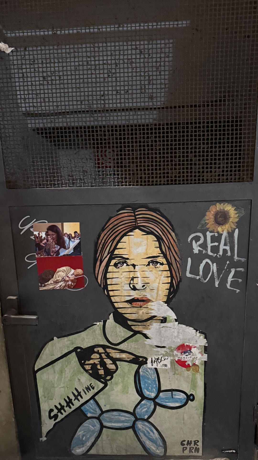 Street art on a Florence door: "Real Love"