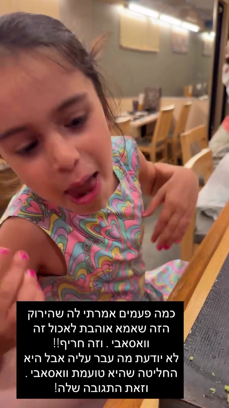 Daughter tries wasabi at a sushi spot in Osaka