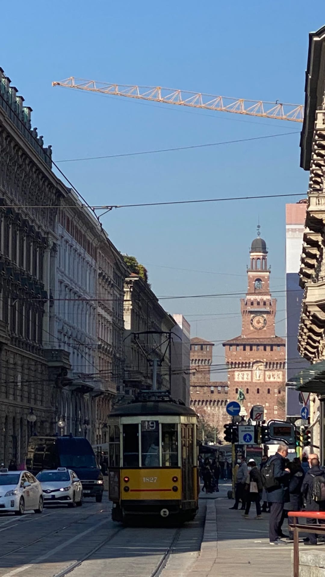 Vintage tram toward Castello Sforzesco, Milan
