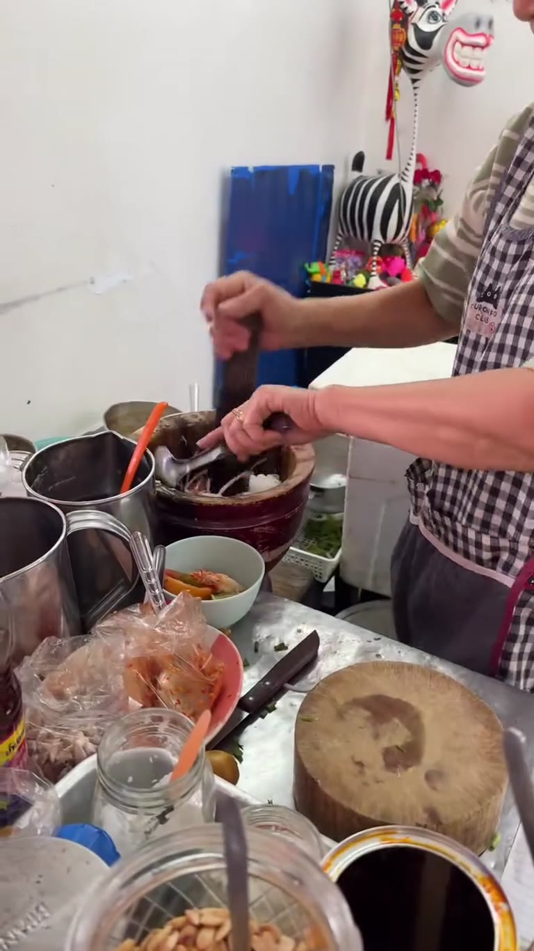 Som tam pounded at a Bangkok street stall