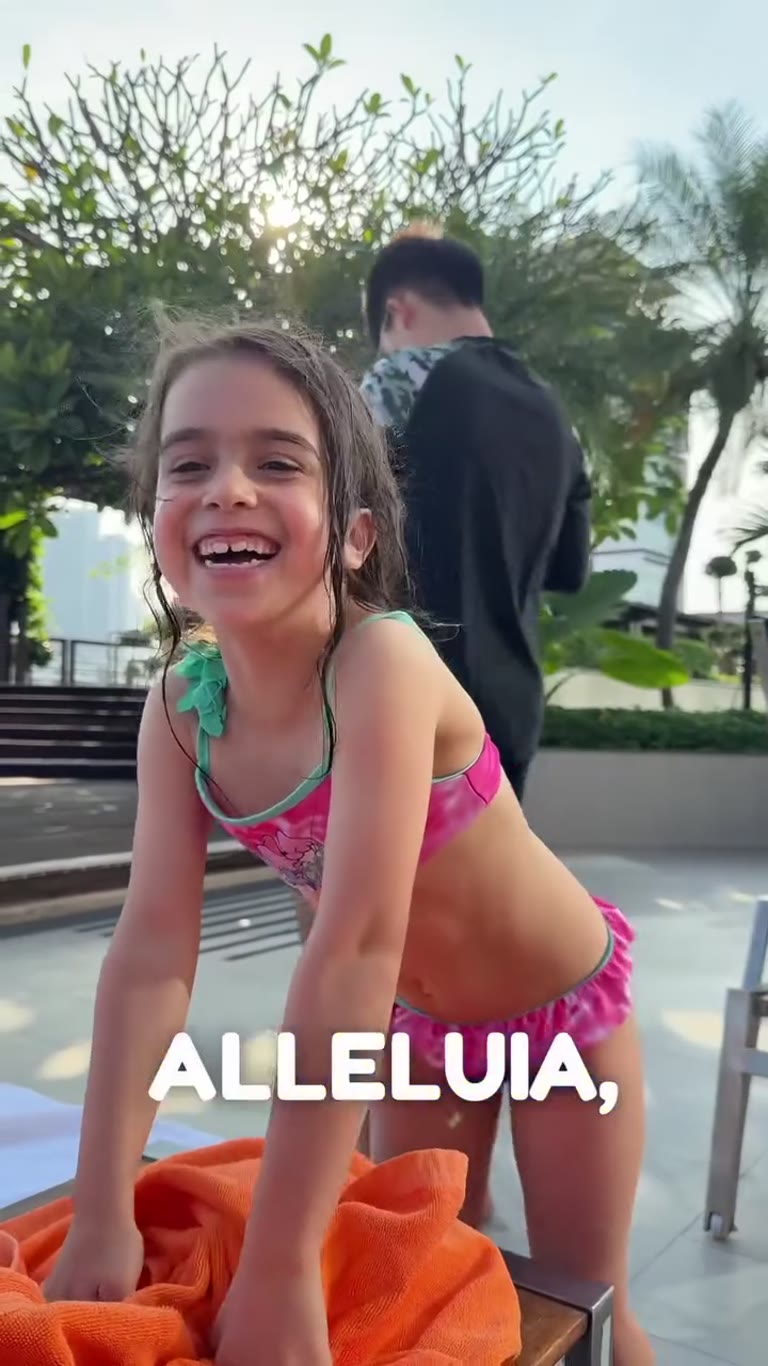 Poolside in Bangkok with a very happy kid