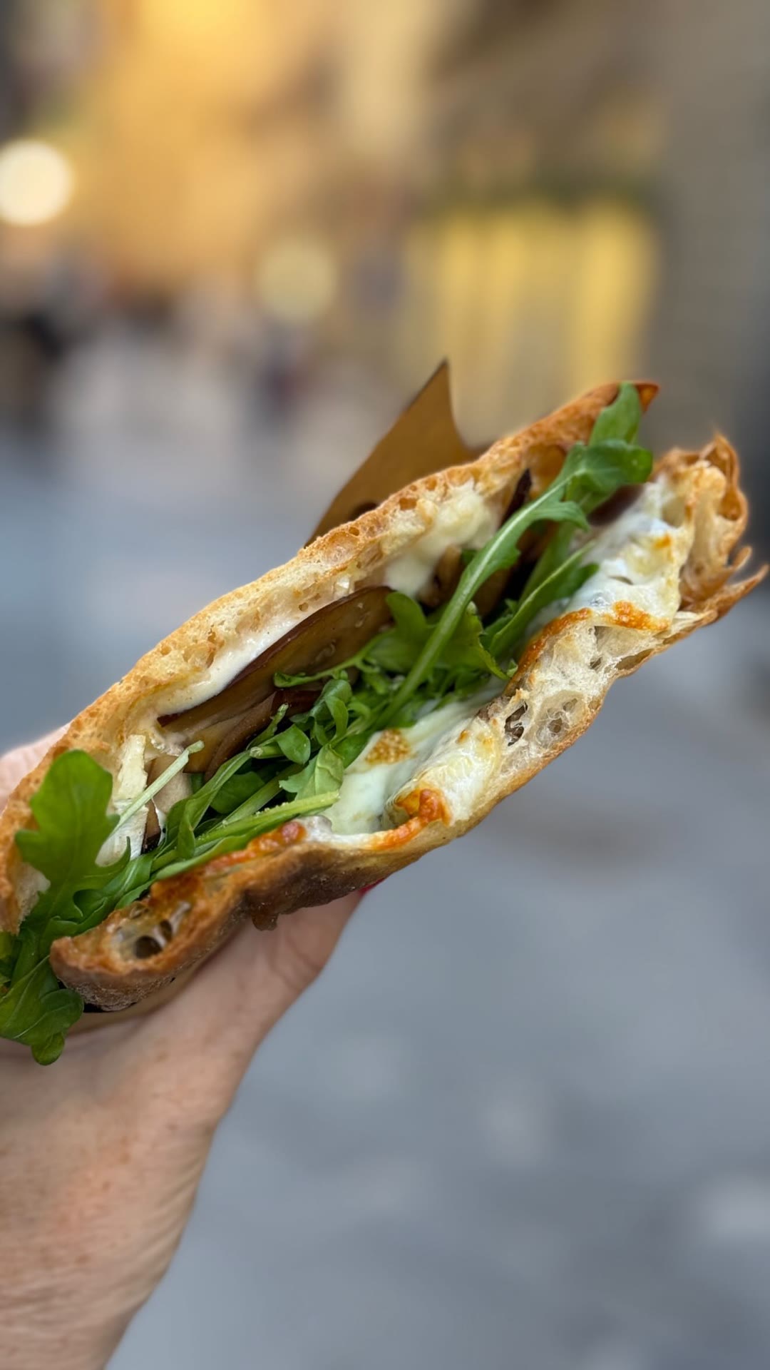 Warm mozzarella and eggplant panino in Florence
