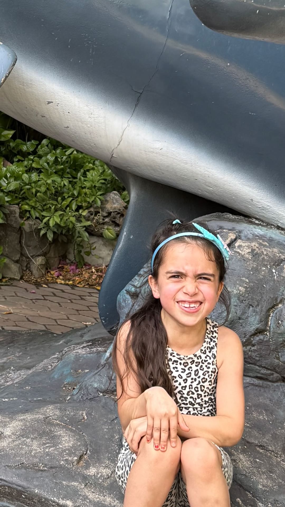 Posing by the orca statue in Bangkok