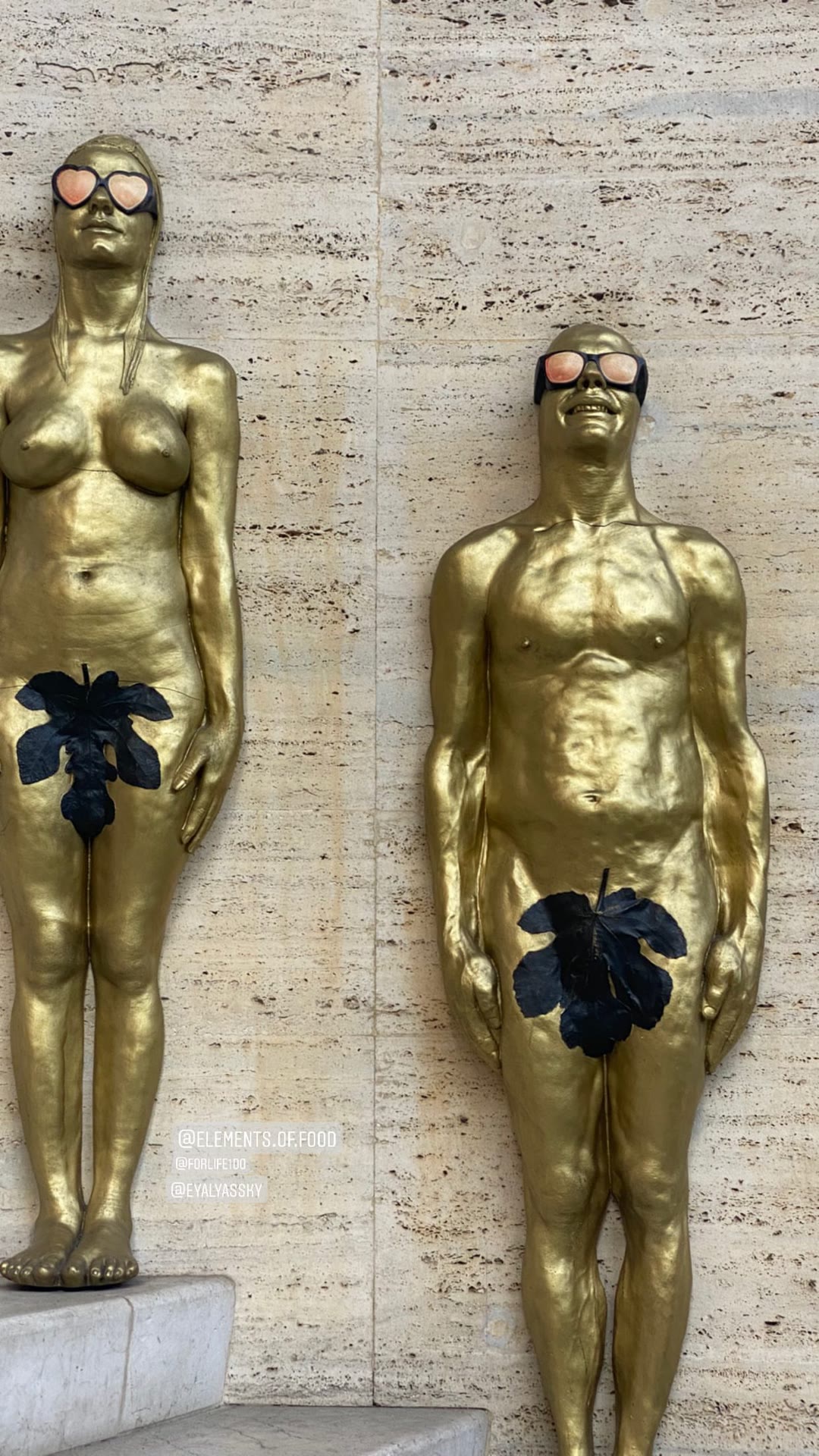 Golden Adam & Eve statues in Milan