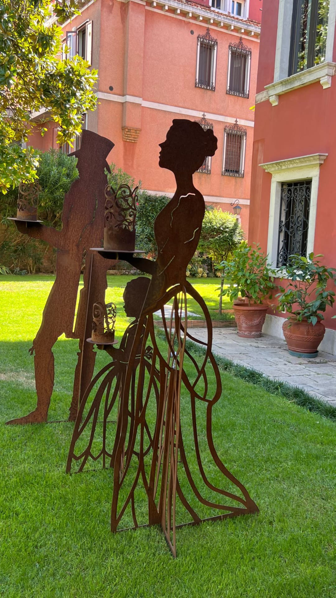 Rusted silhouette sculptures in a Venice garden