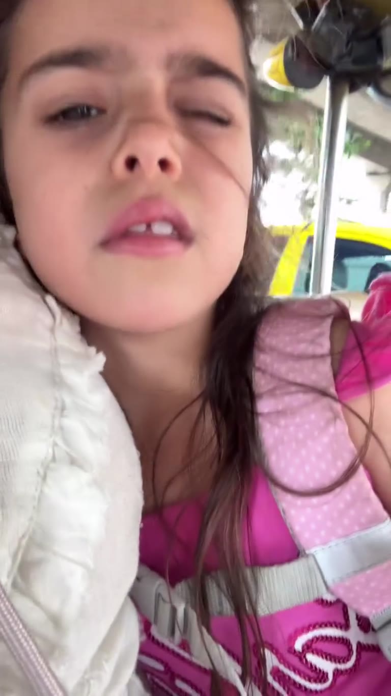 Tuk-tuk ride through Bangkok with a sleepy kid