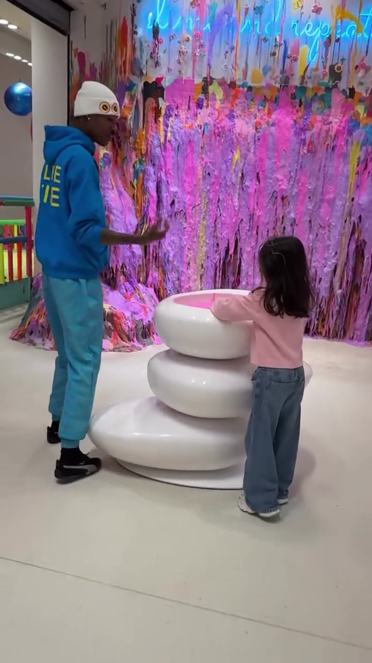 Slime wall high-five at Sloomoo Institute, NYC