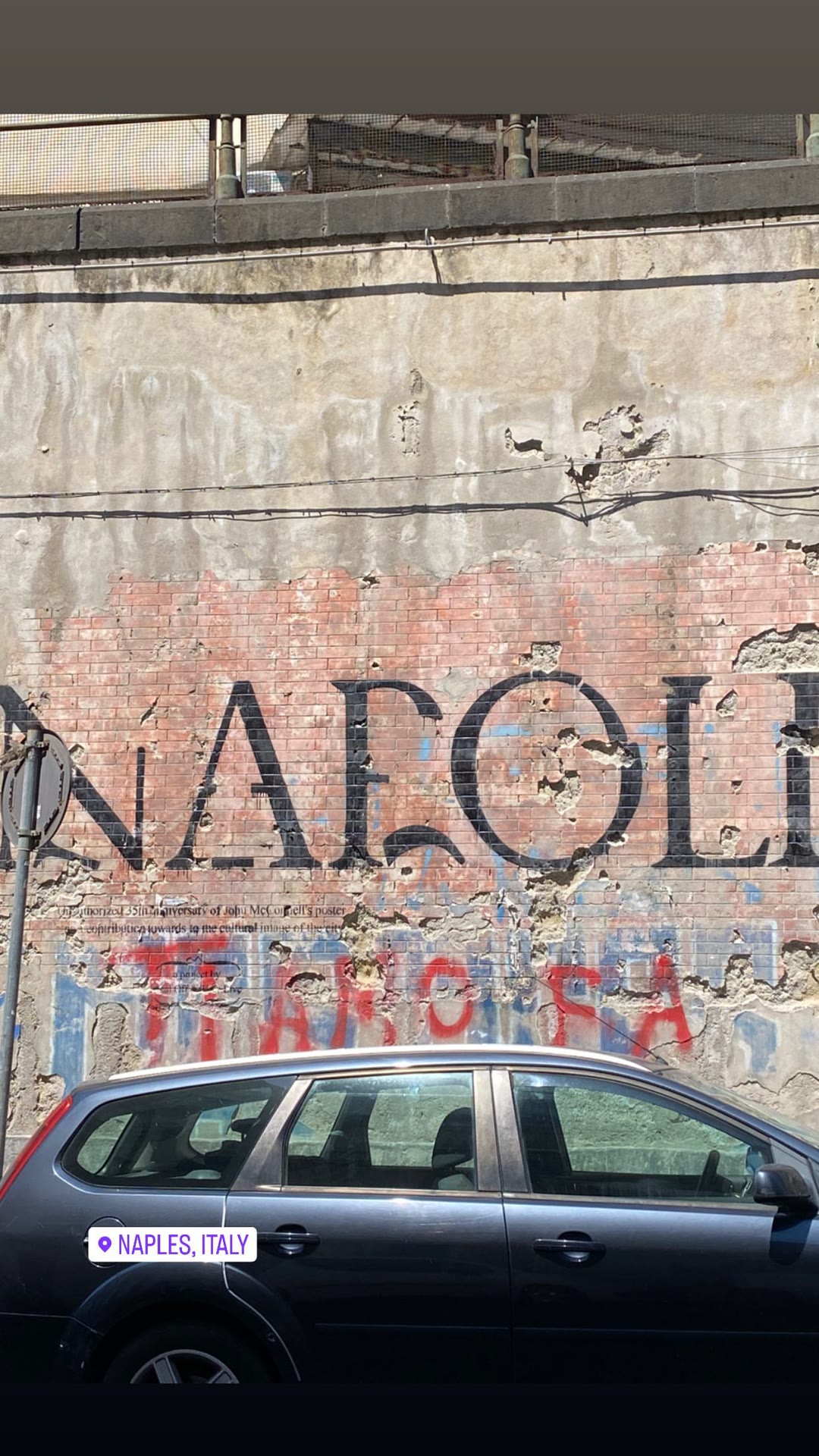 "NAPOLI" mural on a weathered wall