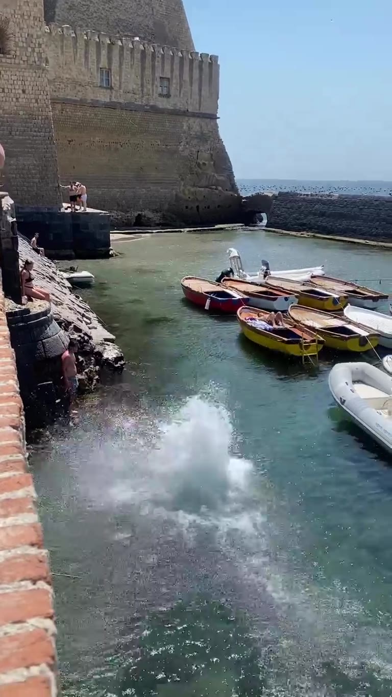 Cliff jumping at Castel dell'Ovo, Naples