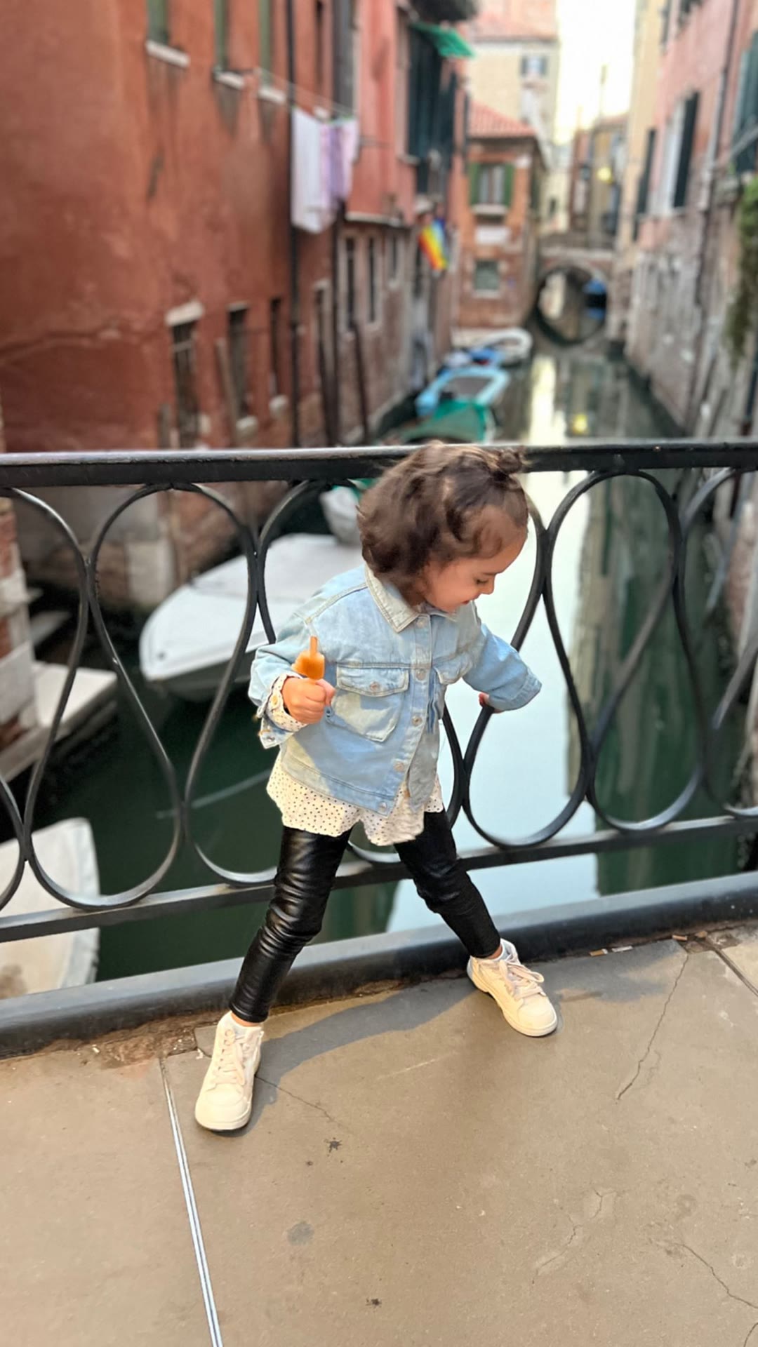 Toddler on a Venice canal bridge