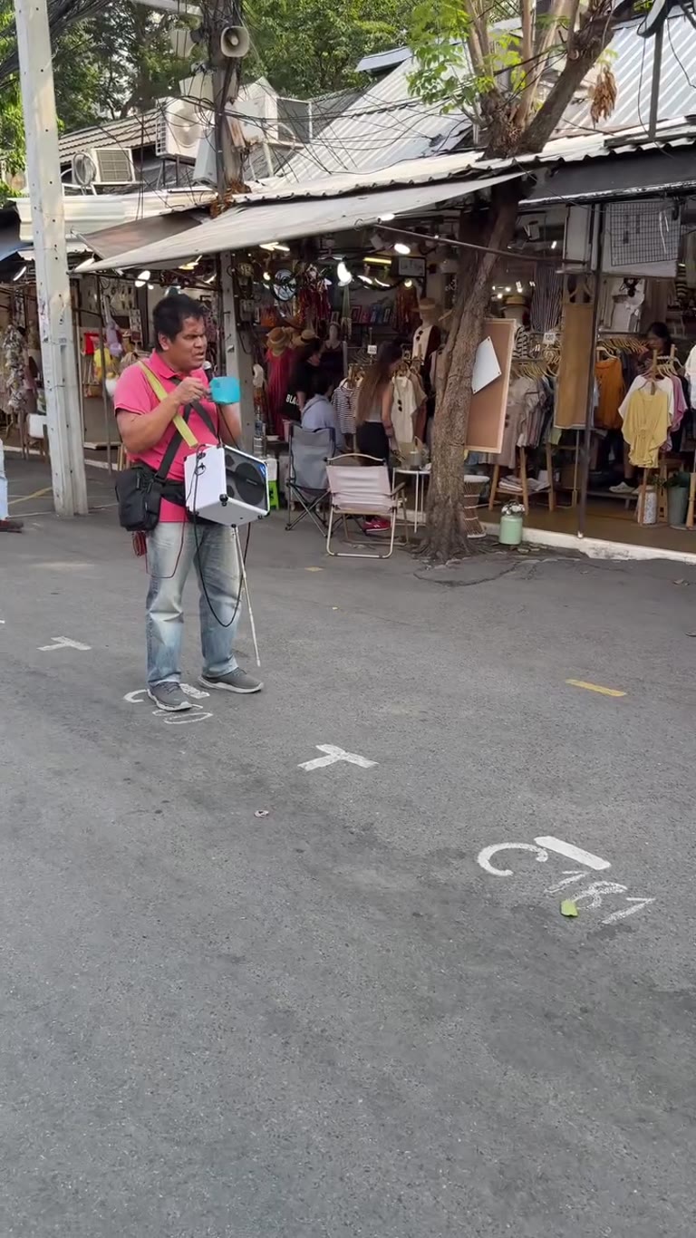 Street singer at a Bangkok market