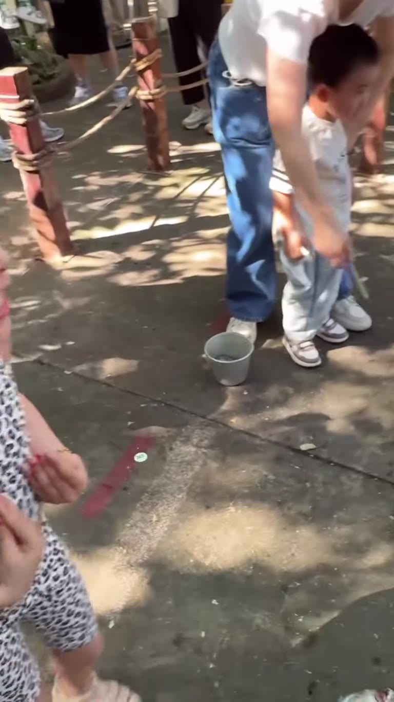Feeding pelicans with the kids in Bangkok
