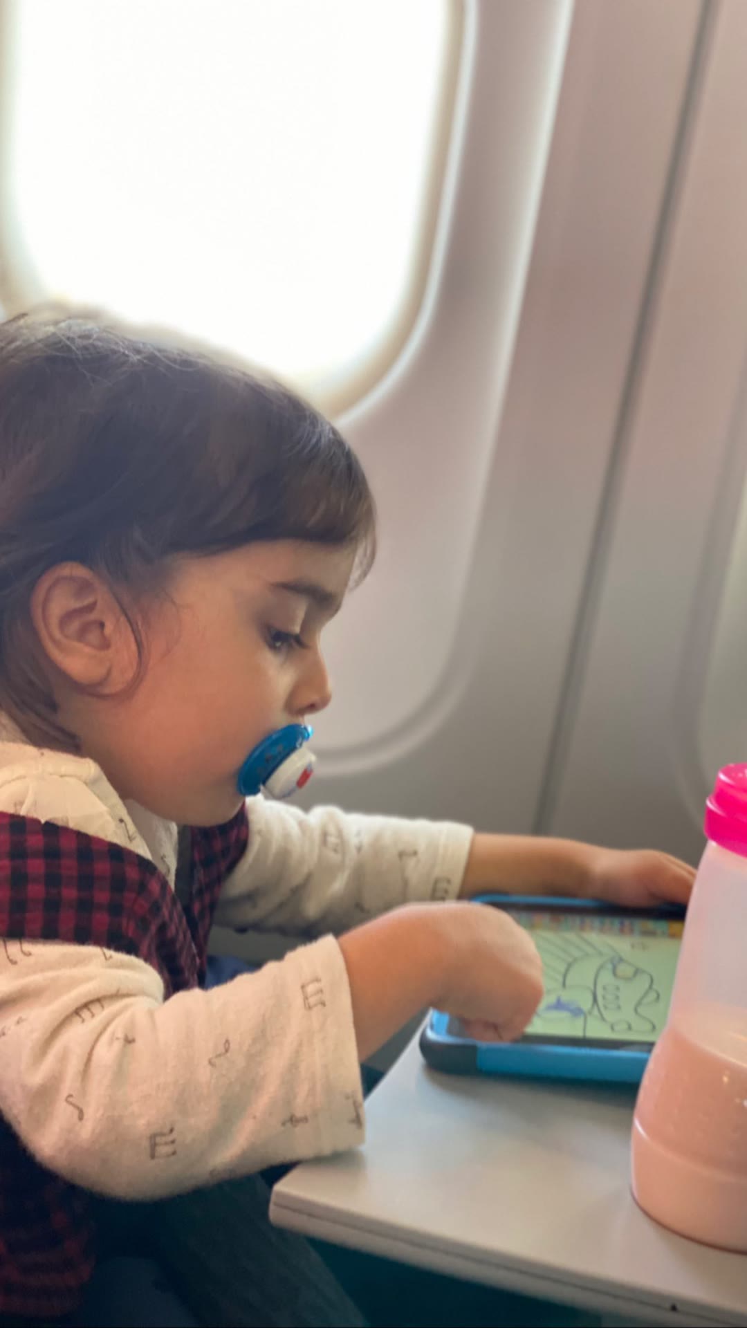 Toddler on the flight to Milan