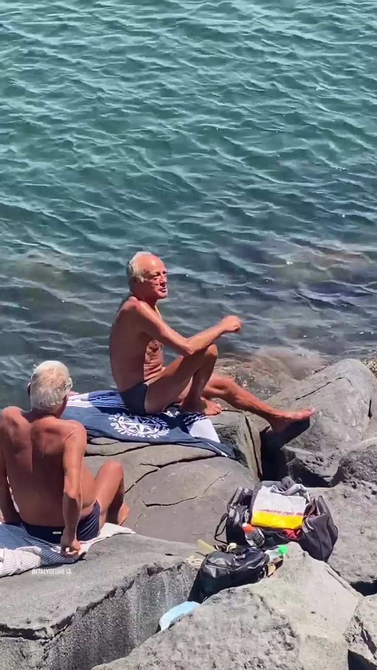 Sunbathing on the rocks in Naples