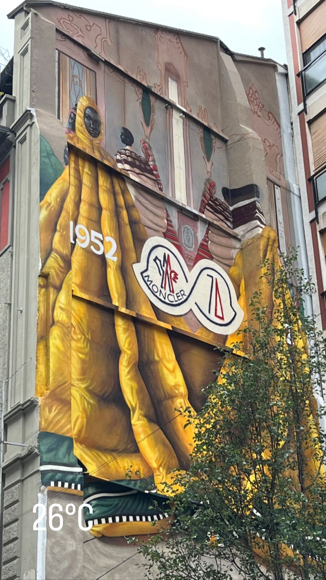 Moncler 1952 mural on a Milan facade