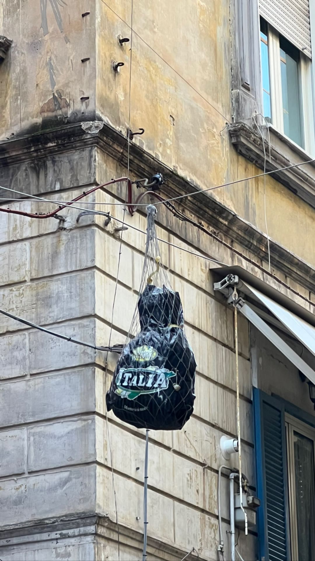Prosciutto hanging over a Naples street