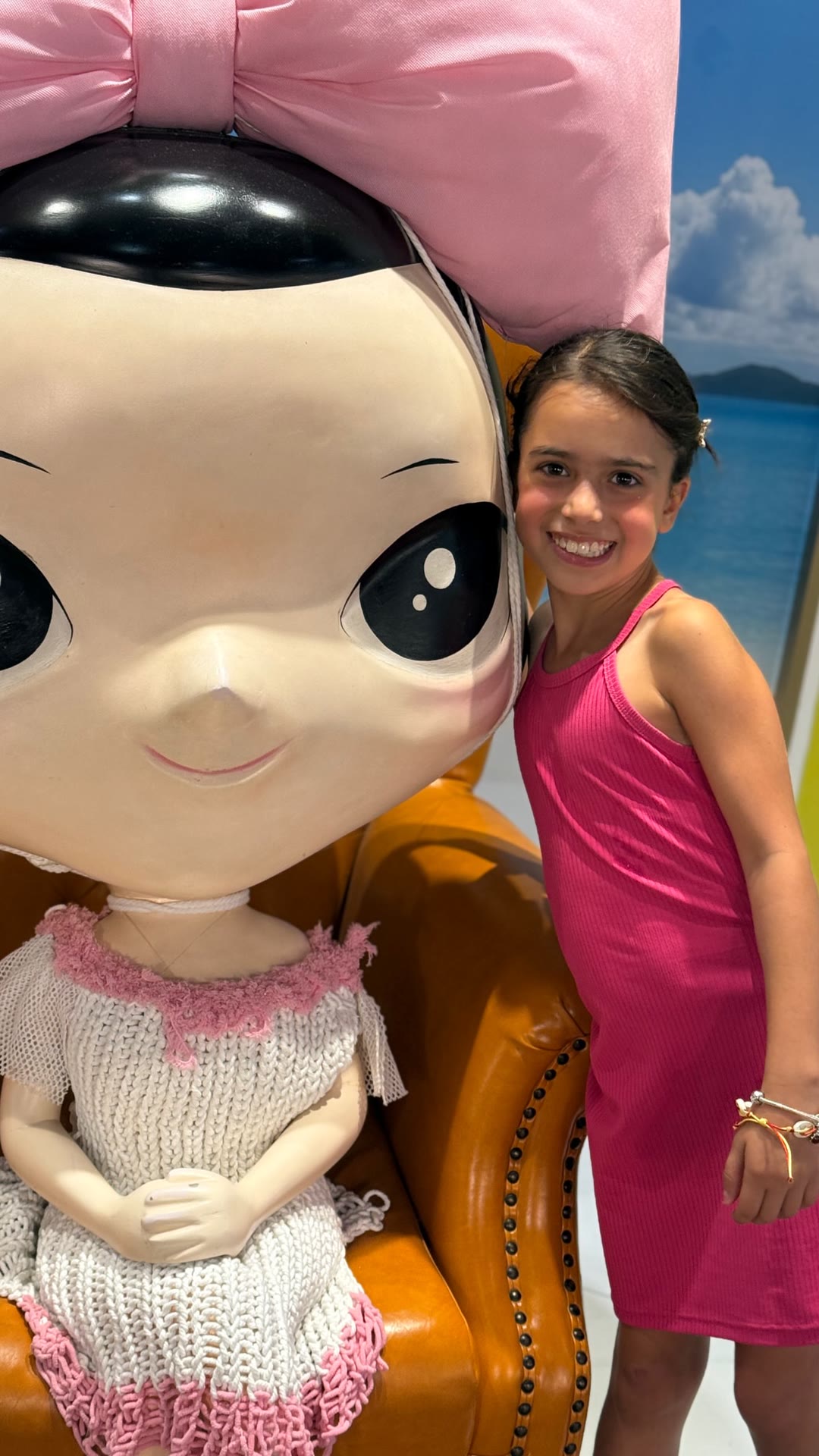 Posing with a giant doll statue in Bangkok