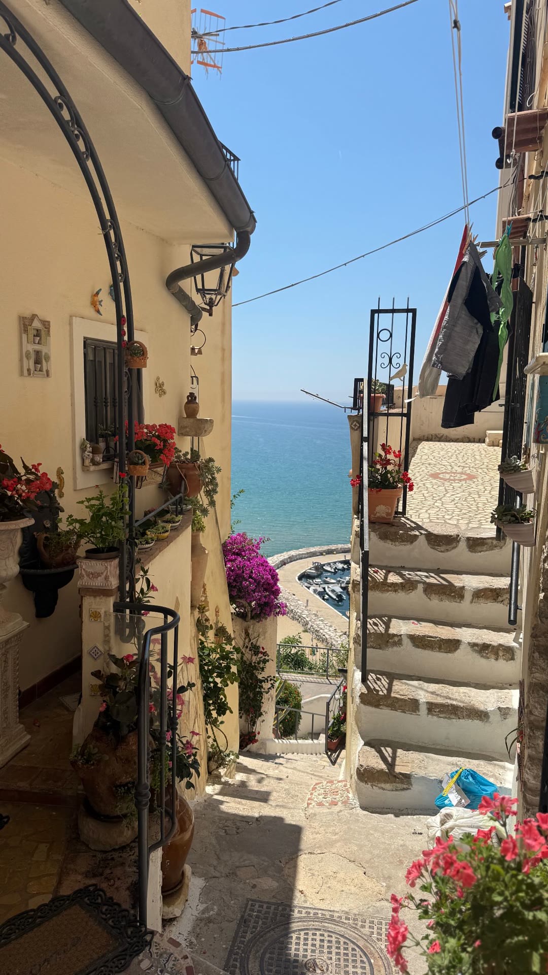 Whitewashed alley over the sea, a day trip from Rome