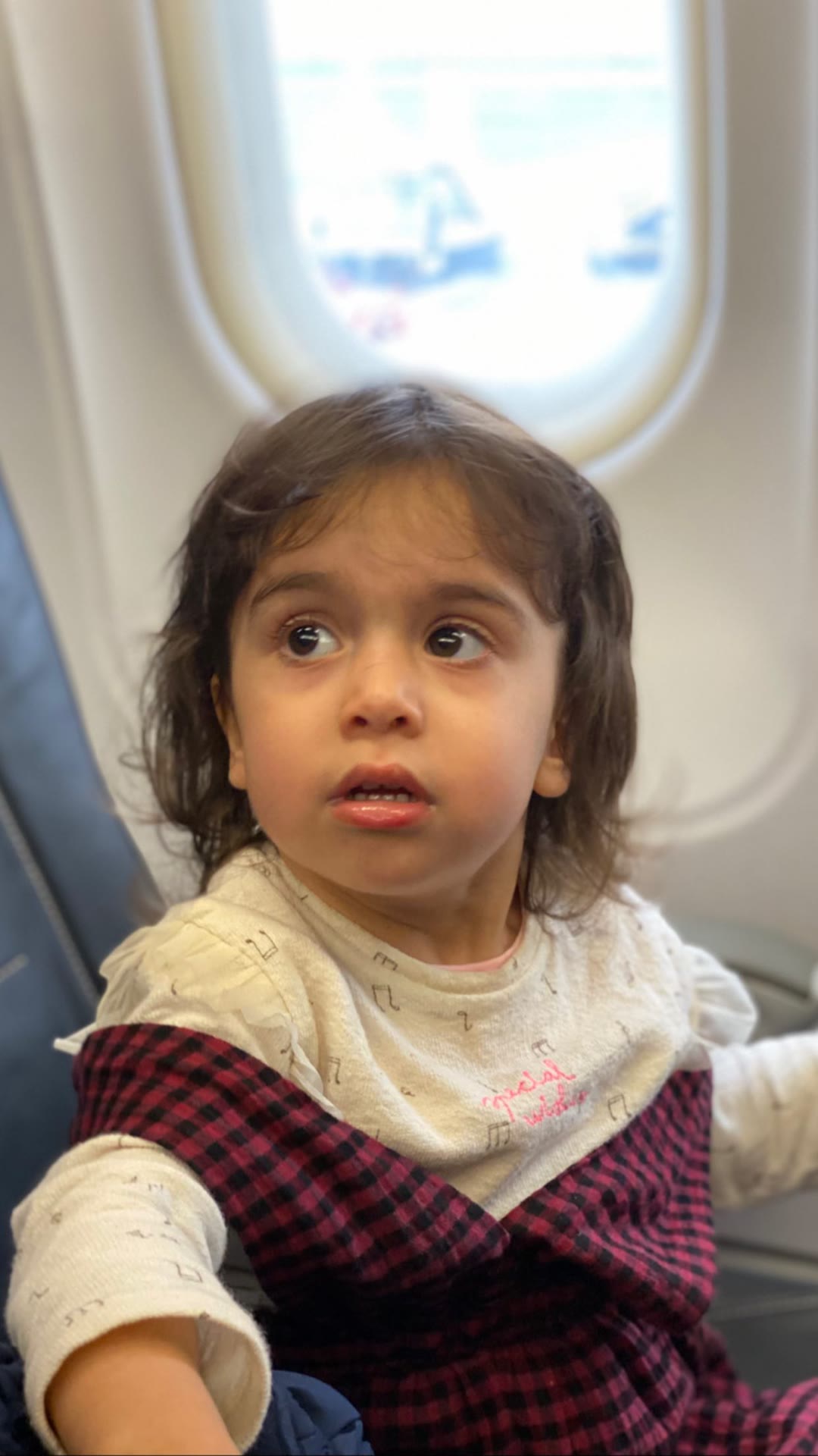 Toddler on the plane to Milan