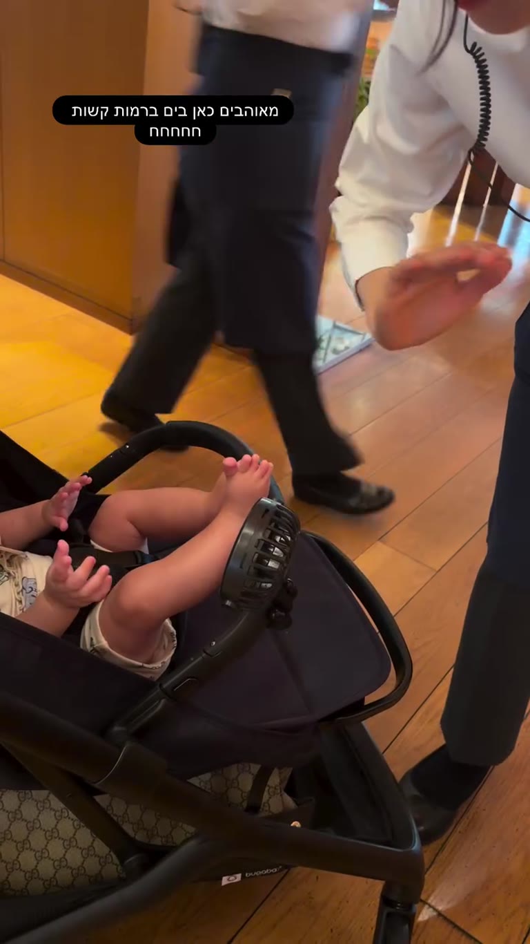 Japanese staff waving bye-bye to the baby