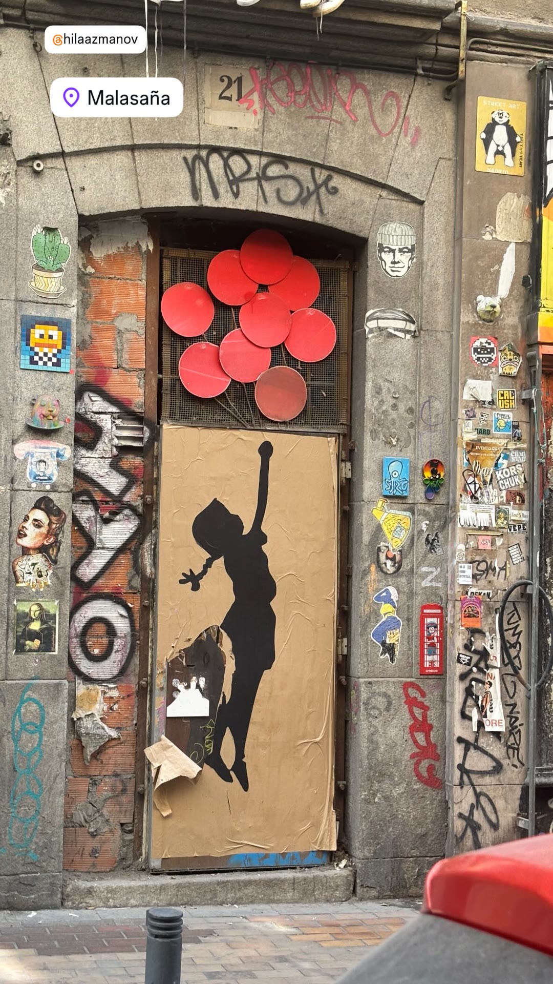 Street art on a Malasaña doorway, Madrid