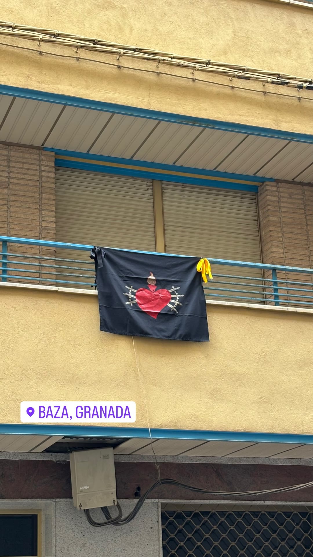 Semana Santa banner on a balcony in Baza