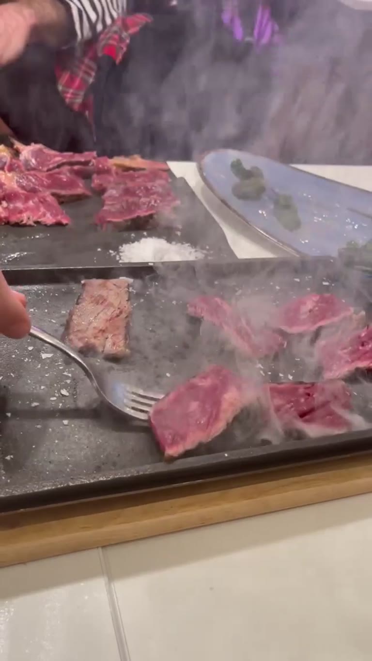 Meat cooked on a hot stone