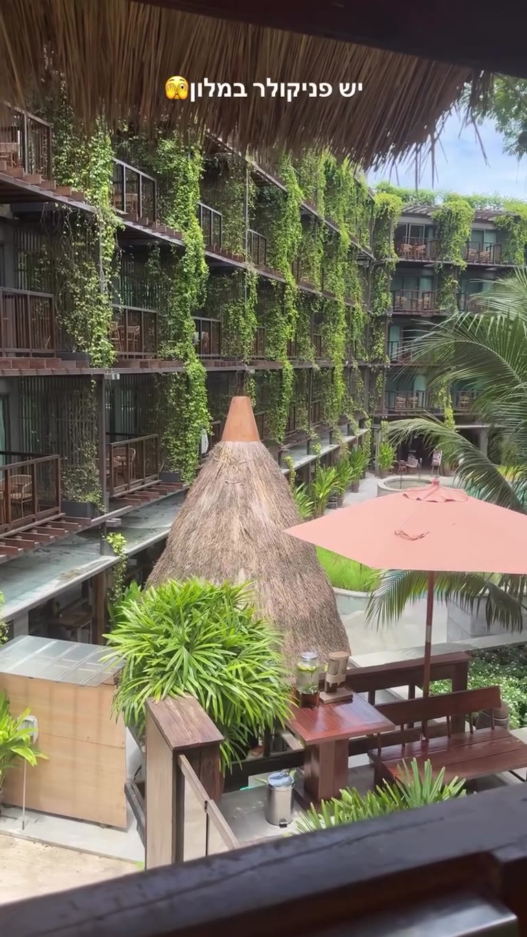 Green hotel courtyard in Phuket — with a funicular