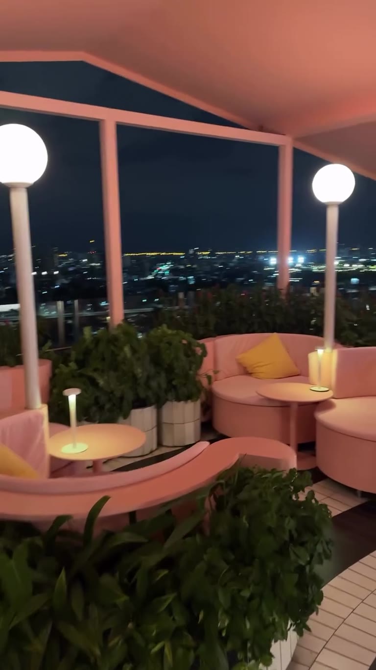 Pink rooftop bar over Bangkok at night