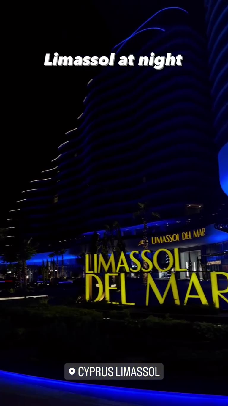 Limassol at night: Del Mar tower & a sports bar