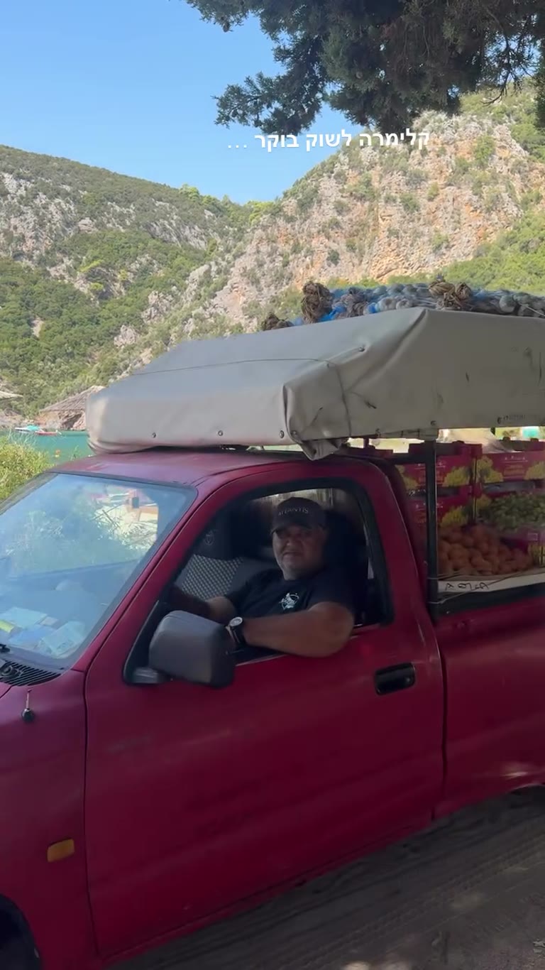 Morning fruit truck market on a Skopelos beach
