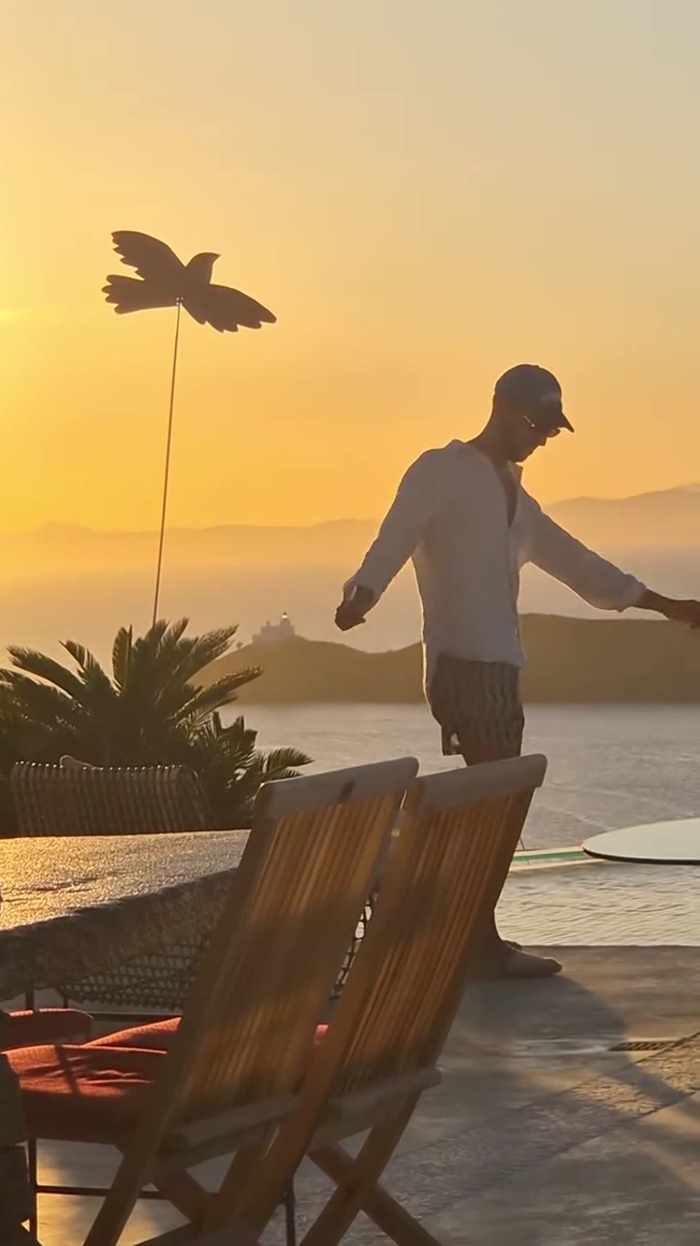 Sunset dance on a pool terrace in Kea