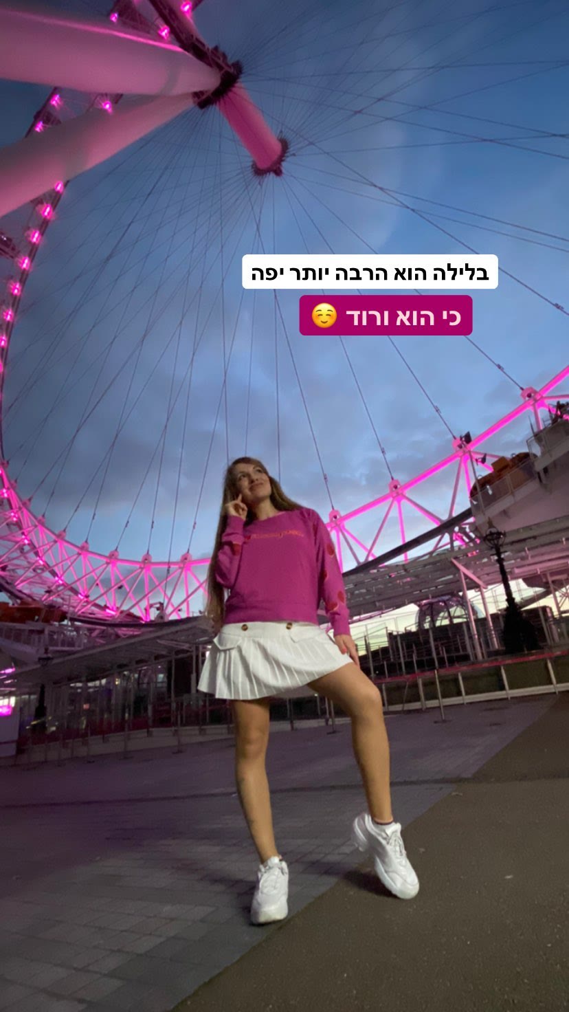 London Eye at night, lit up pink