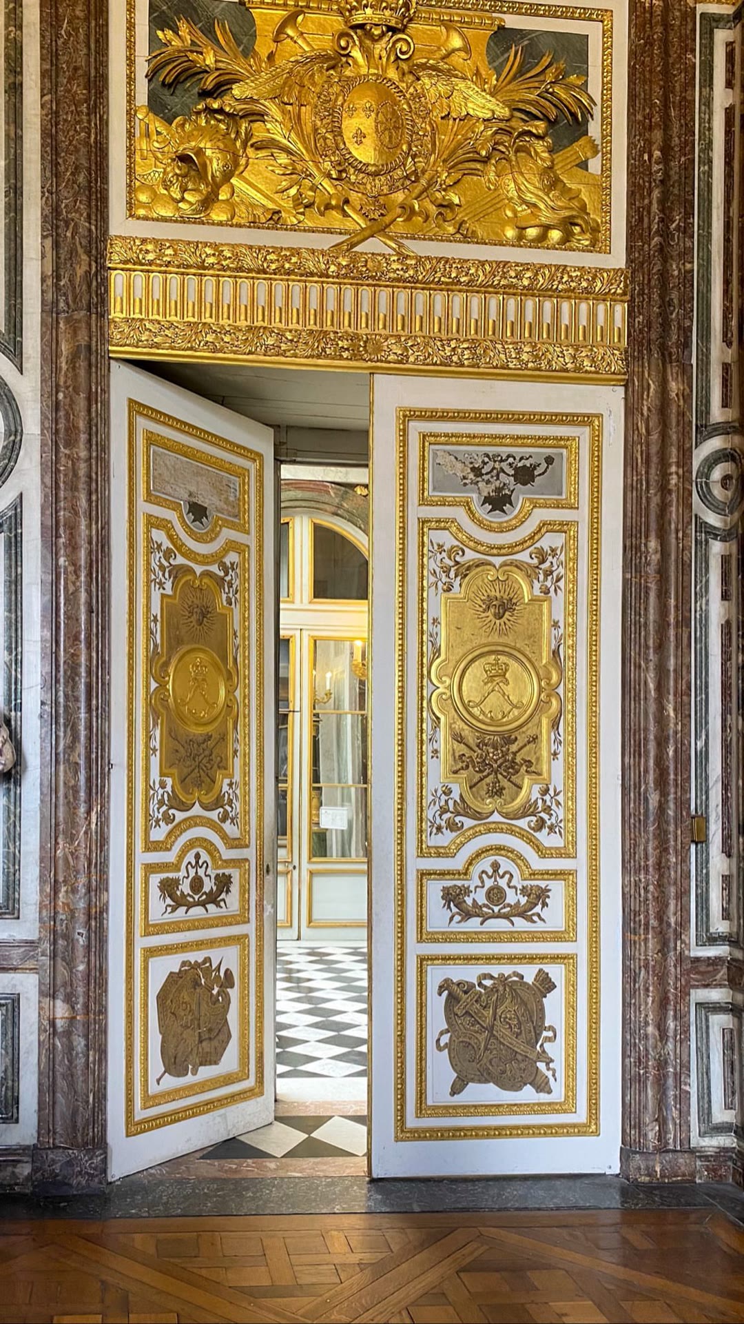 Gilded doors inside the Palace of Versailles