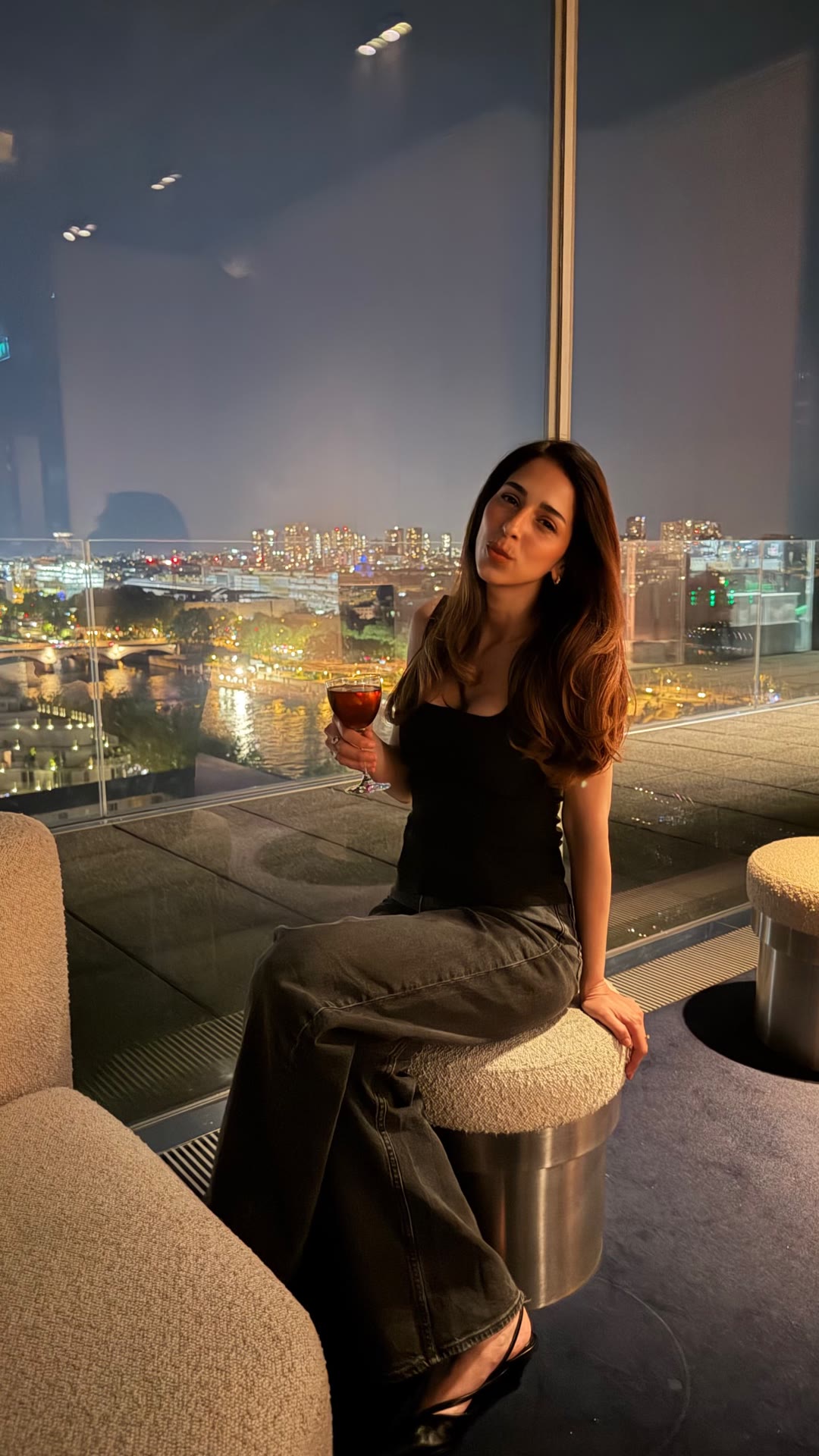 Cocktail with a skyline view at a rooftop bar