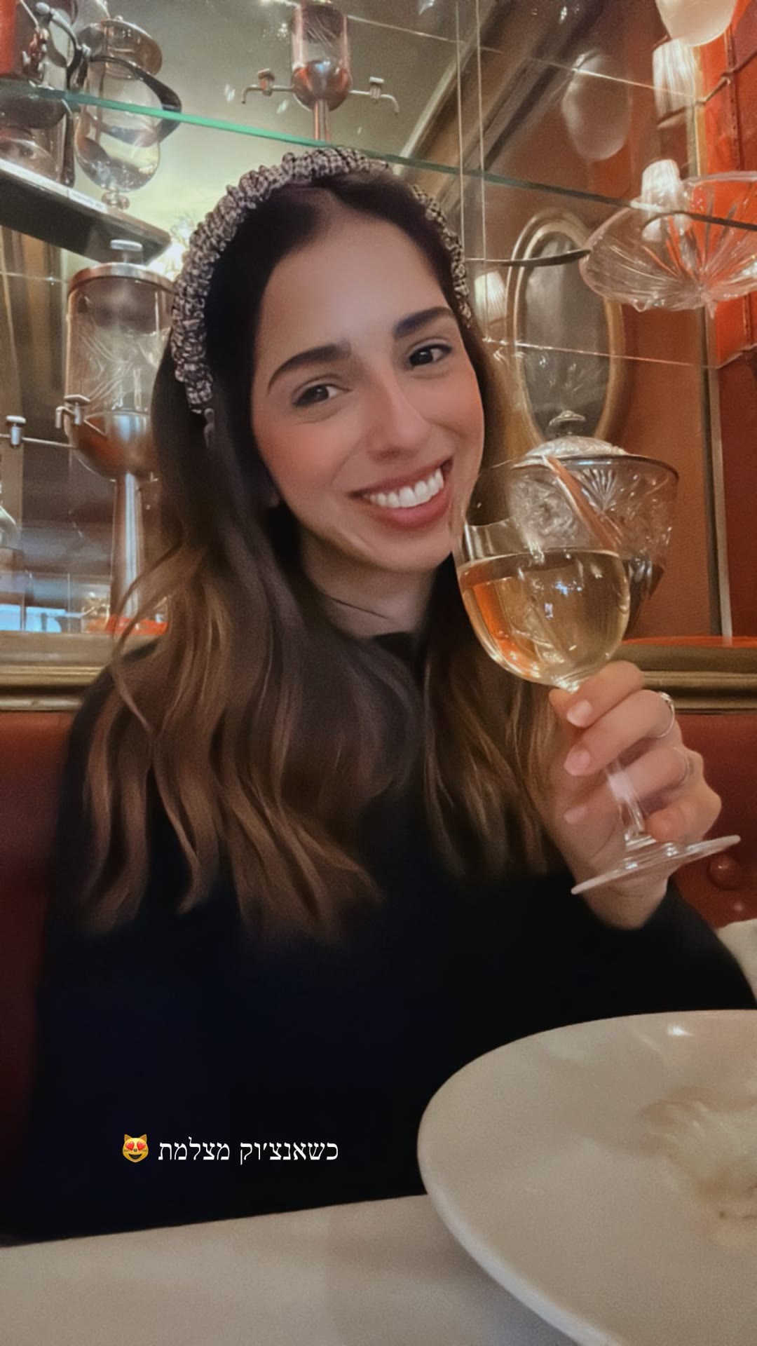 Wine selfie in a Paris bistro booth