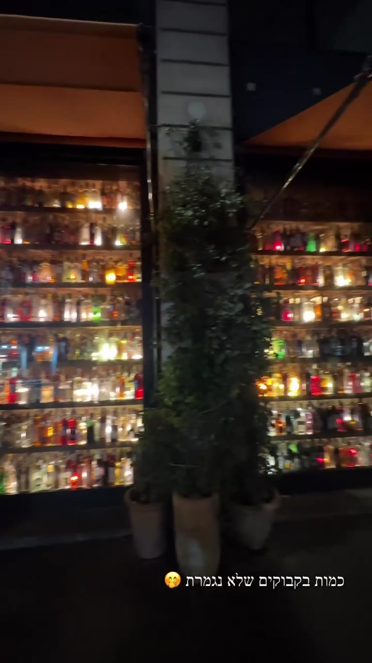 Endless bottle wall at a Neapolitan spot in Paris