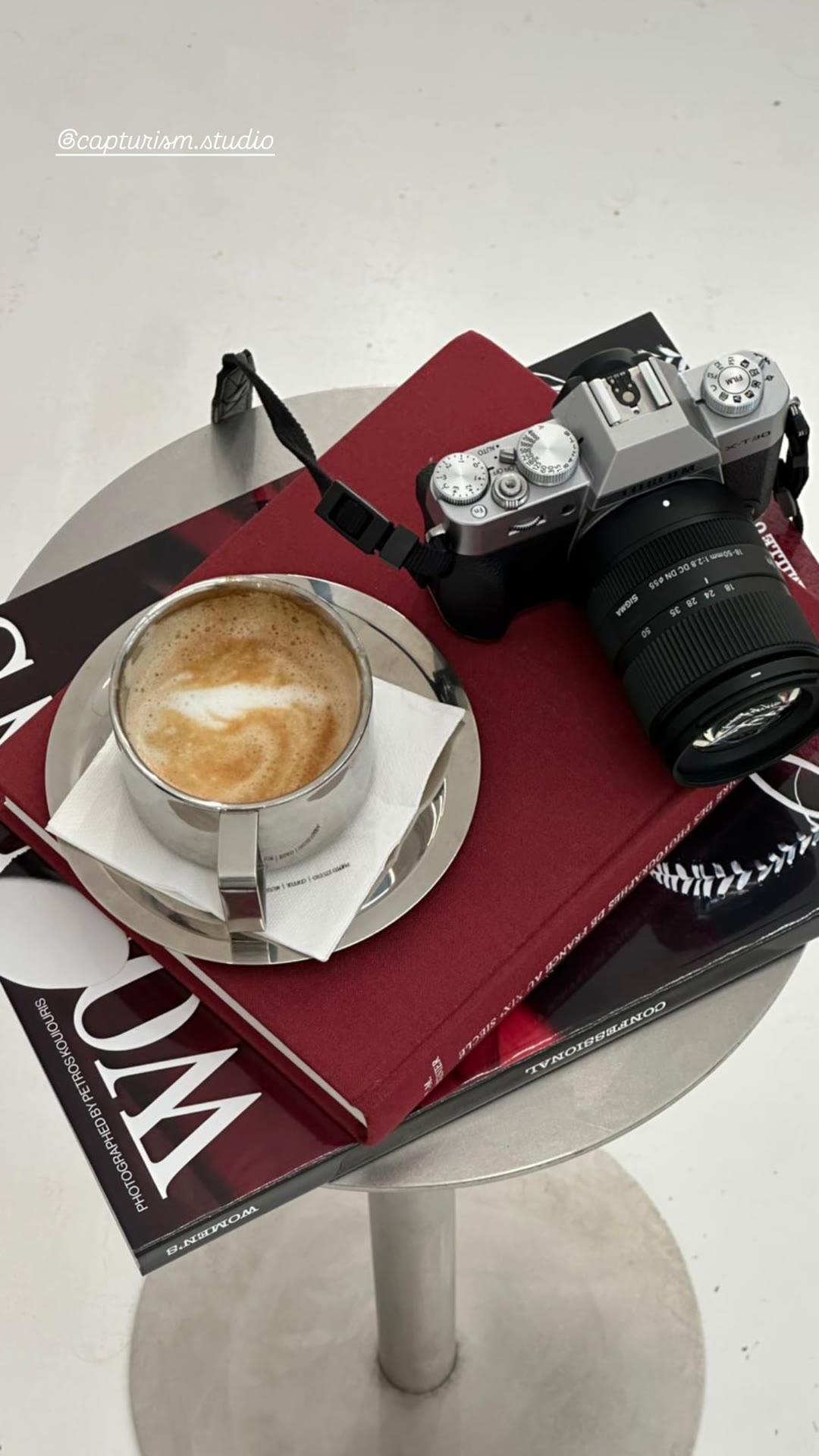 Café stop with camera and photo books