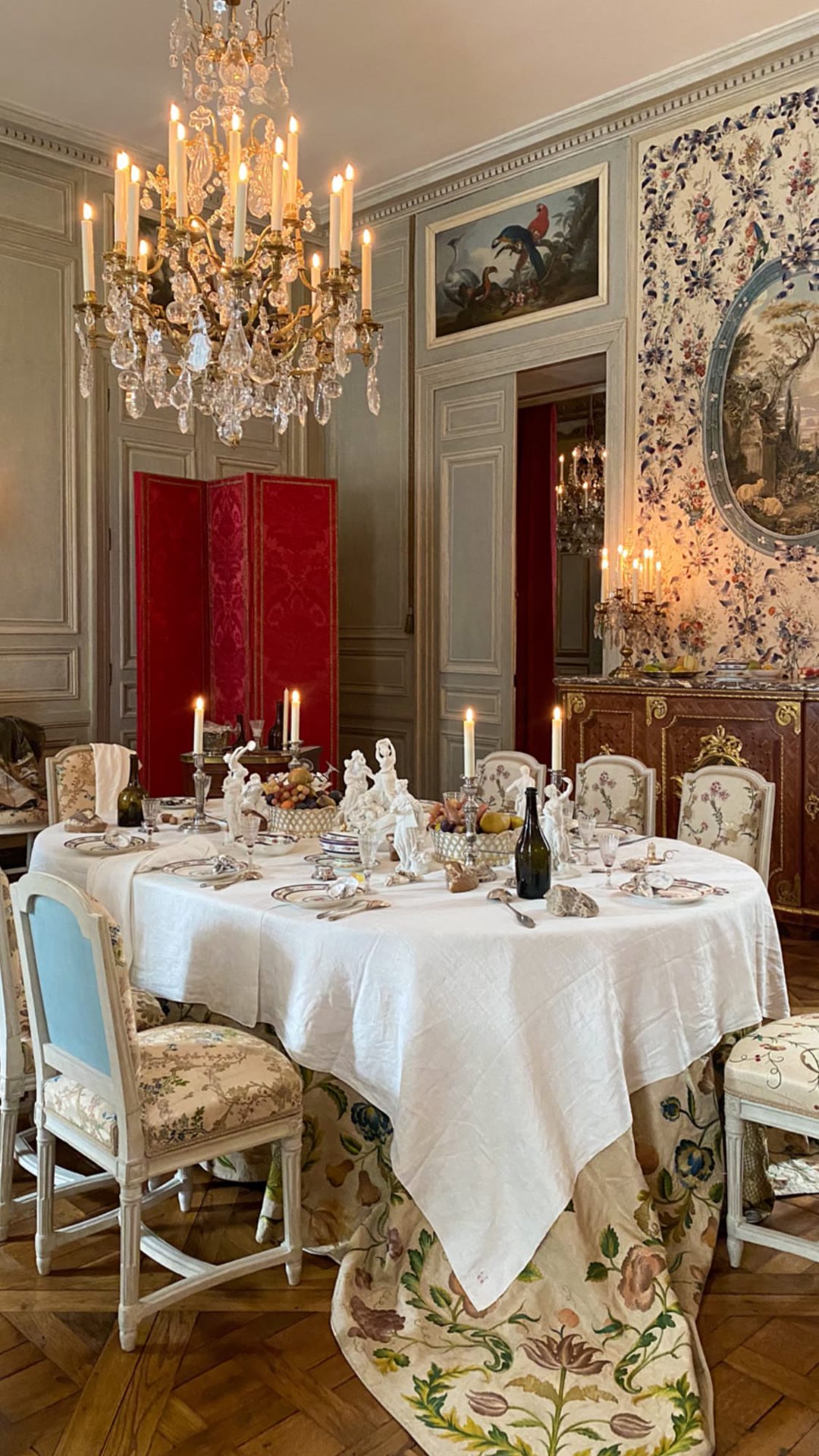 Candlelit 18th-century dining room in a Paris museum